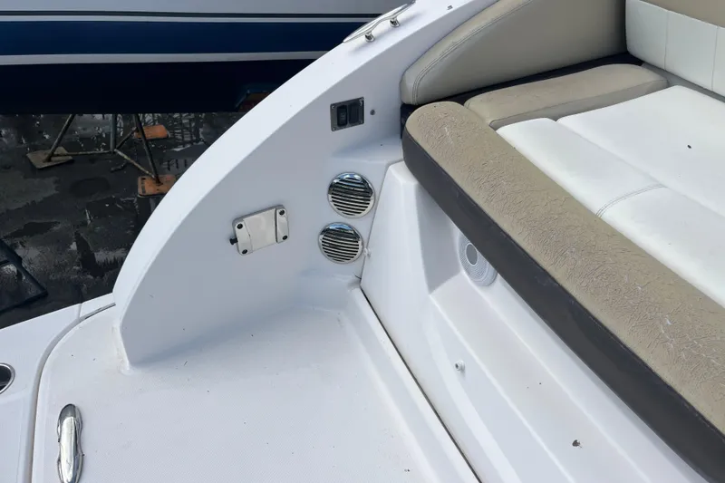 Slide: The Image of 2014 Regal 3200 Bowrider interior with beige seating and speaker system. - 34