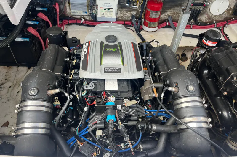 Slide: The Image of Engine compartment of a 2014 Regal 3200 Bowrider, featuring a 350 MAG engine. - 36