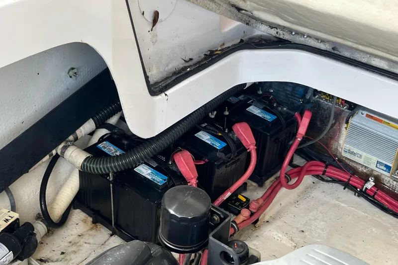 Slide: The Image of Battery compartment of 2014 Regal 3200 Bowrider with wiring and components. - 37