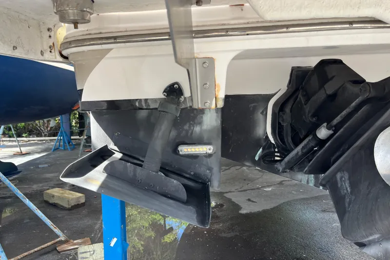 Slide: The Image of 2014 Regal 3200 Bowrider boat stern drive and propeller detail. - 40