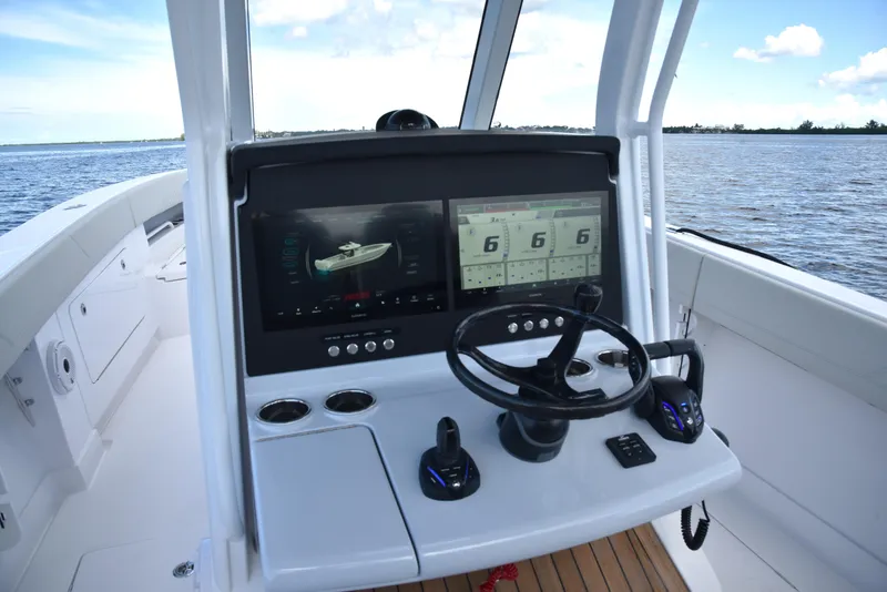 Slide: The Image of Helm of 2025 Jupiter 380 LS boat with advanced navigation displays. - 4