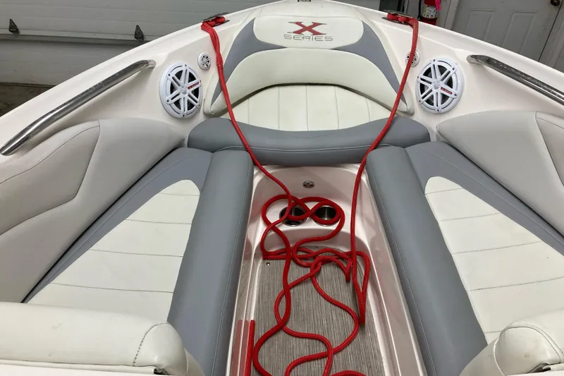 Slide: The Image of 2008 MasterCraft MariStar 215 boat interior with red rope and speakers. - 11
