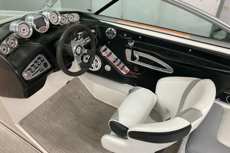 Slide: The Image of 2008 MasterCraft MariStar 215 boat interior with steering wheel and control panel. - 6