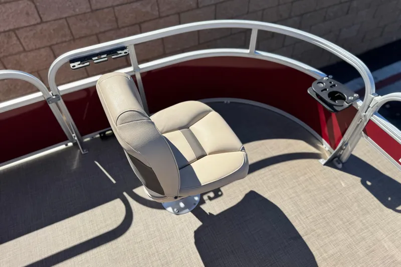 Slide: The Image of 2023 Sun Tracker Bass Buggy 16 XL boat seat with beige upholstery and railing. - 11