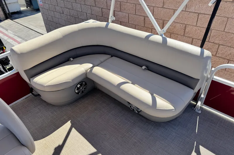 Slide: The Image of 2023 Sun Tracker Bass Buggy 16 XL pontoon boat seating area with beige upholstery. - 15