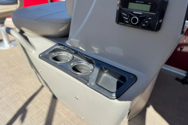 Slide: The Image of 2023 Sun Tracker Bass Buggy 16 XL boat console with cup holders and stereo system. - 20