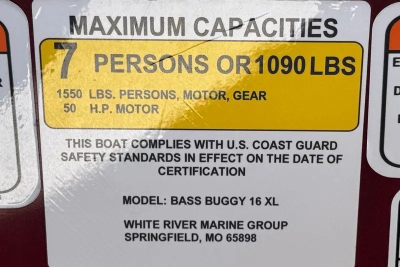 Slide: The Image of 2023 Sun Tracker Bass Buggy 16 XL capacity label, 7 persons or 1090 lbs, 50 HP motor. - 24