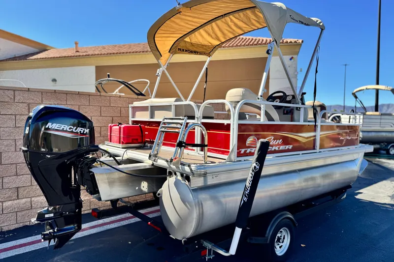 Slide: The Image of 2023 Sun Tracker Bass Buggy 16 XL pontoon boat with Mercury outboard motor. - 6