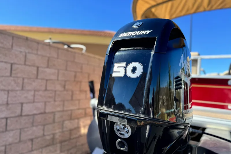 Slide: The Image of 2023 Sun Tracker Bass Buggy 16 XL with Mercury 50 engine, outdoor setting. - 8