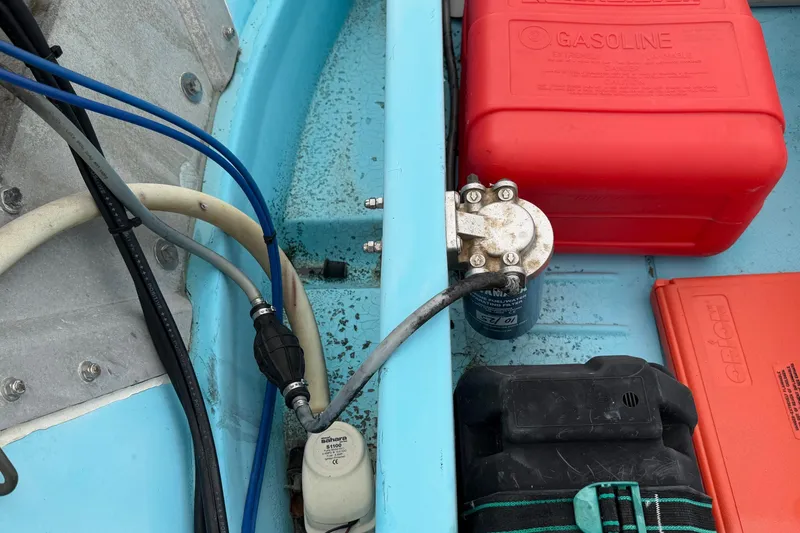Slide: The Image of Interior of a 1967 Boston Whaler 13 with fuel tank and wiring. - 11