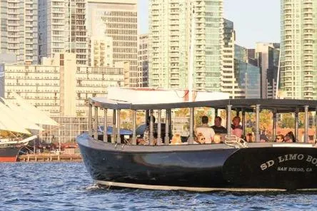 The Image of Custom 1983 Limo Boat cruising near city skyline, San Diego waterfront. - 0