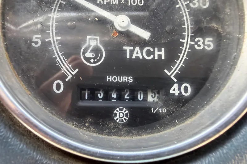 Slide: The Image of Tachometer of 1983 Custom Limo Boat showing 134205 hours, RPM x 100. - 19