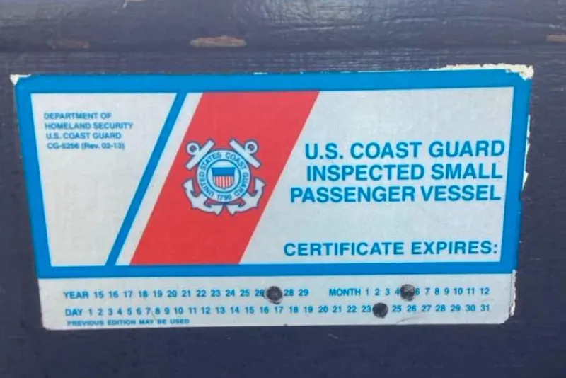 Slide: The Image of U.S. Coast Guard inspection sticker for 1983 Custom Limo Boat, certificate expiration details. - 20