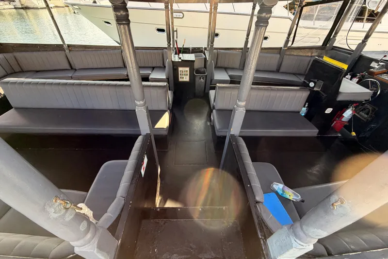 Slide: The Image of Interior of a 1983 Custom Limo Boat with spacious seating and modern amenities. - 7