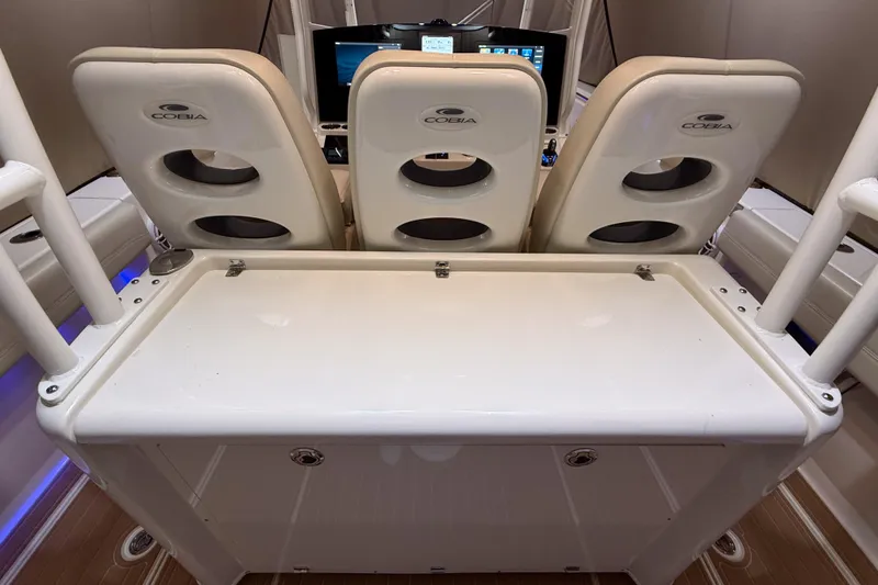 Slide: The Image of 2021 Cobia 350 CC boat interior with helm seats and control panel. - 12