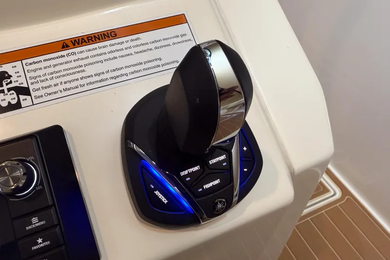 Slide: The Image of Joystick control panel on 2021 Cobia 350 CC boat with carbon monoxide warning label. - 17
