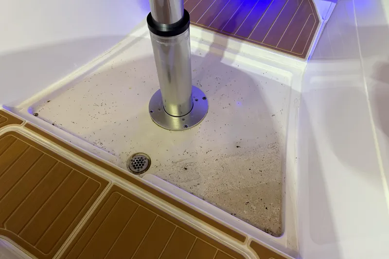 Slide: The Image of Cobia 350 CC 2021 boat deck with drain and pedestal, featuring non-slip flooring. - 26
