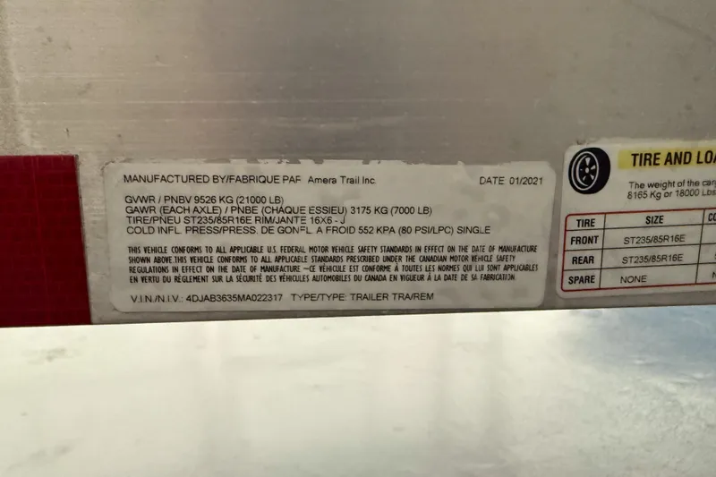 Slide: The Image of Label on a 2021 Cobia 350 CC trailer, detailing weight and tire specifications. - 35