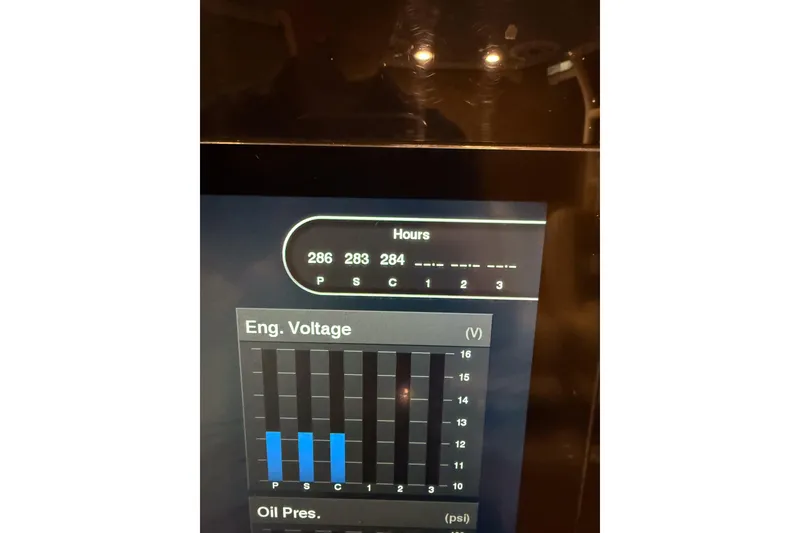 Slide: The Image of Display screen of 2021 Cobia 350 CC showing engine hours and voltage readings. - 5