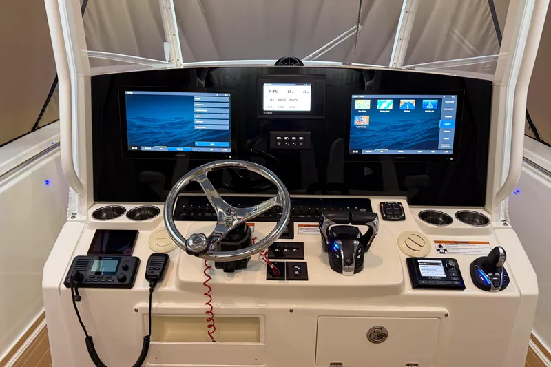 Slide: The Image of 2021 Cobia 350 CC helm with dual displays and advanced controls. - 7