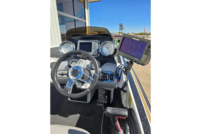 Slide: The Image of Steering console of 2010 Nitro Z-9 boat with gauges and Lowrance HDS-5 display. - 3