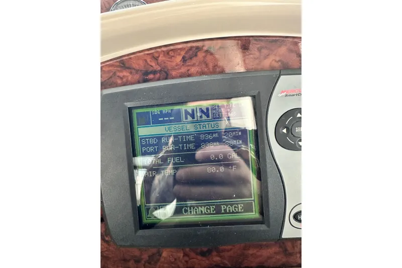 Slide: The Image of Dashboard display of a 2004 Sea Ray 320 Sundancer showing vessel status and settings. - 16