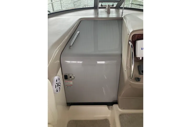 Slide: The Image of 2004 Sea Ray 320 Sundancer cabin entrance with sleek design and modern features. - 18
