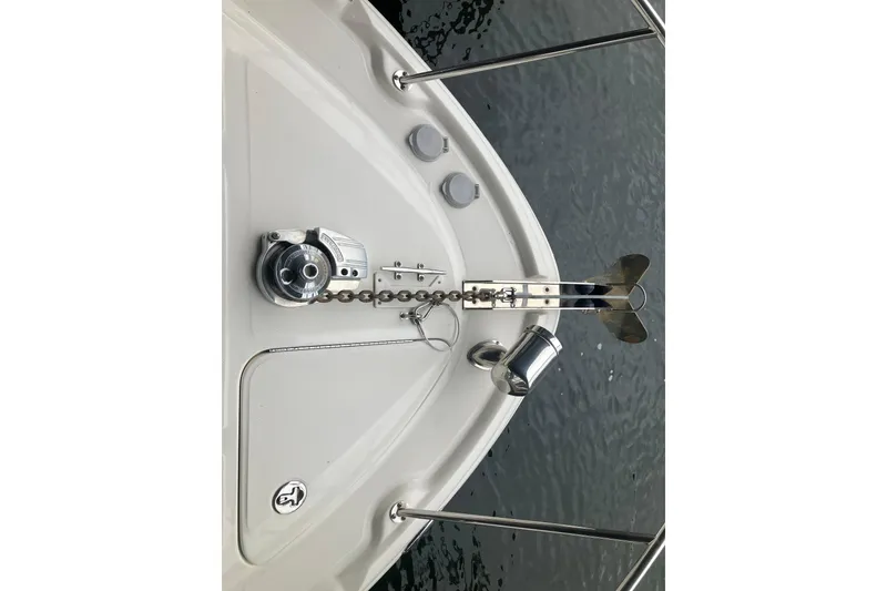 Slide: The Image of Bow of 2004 Sea Ray 320 Sundancer with anchor and chain mechanism. - 21
