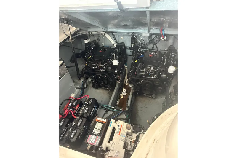 Slide: The Image of Engine compartment of 2004 Sea Ray 320 Sundancer with dual engines and batteries. - 38