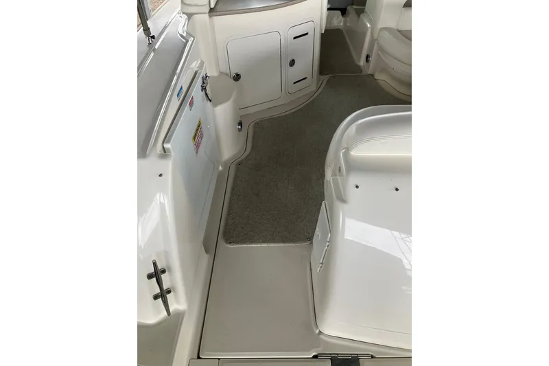Slide: The Image of Interior view of 2004 Sea Ray 320 Sundancer boat, featuring clean white surfaces. - 9
