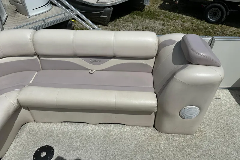 Slide: The Image of 2003 Crest 25 II LM boat interior with beige seating and speaker. - 13
