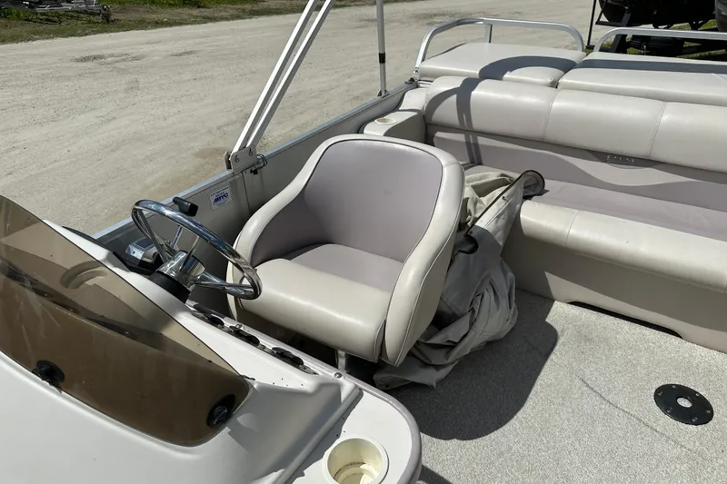 Slide: The Image of 2003 Crest 25 II LM boat interior with steering wheel and seating. - 8