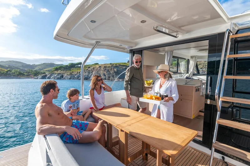 Slide: The Image of People enjoying leisure time on a 2025 Beneteau Swift Trawler 41 Fly yacht. - 15