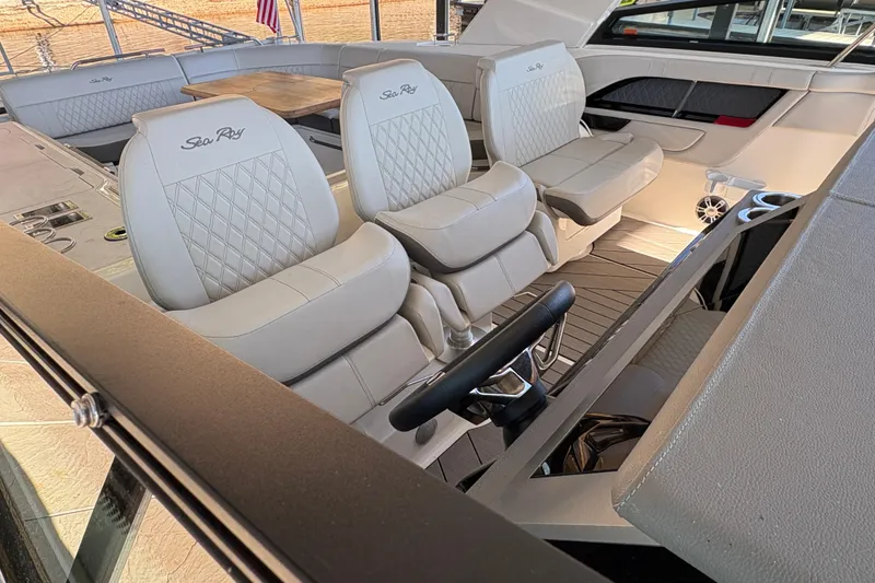 Slide: The Image of Dashboard of 2023 Sea Ray SLX 400 showing engine hours and RPM gauge. - 23