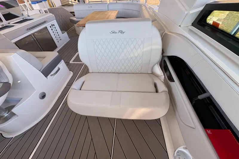 Slide: The Image of 2023 Sea Ray SLX 400 helm with modern controls and luxurious seating. - 25