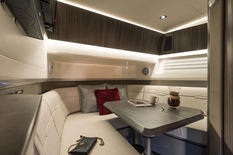 Slide: The Image of Manufacturer Provided Image: 2023 Sea Ray SLX 400 boat with luxurious seating and wooden table. - 37