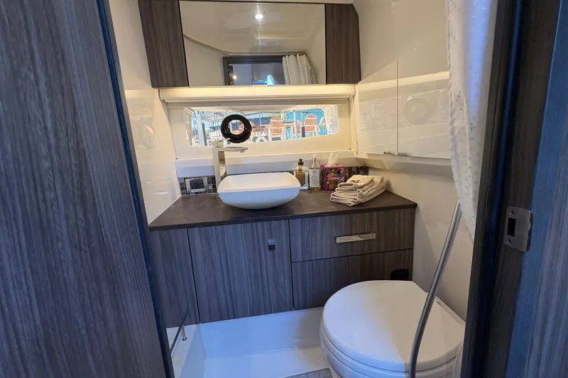 Slide: The Image of Interior of 2023 Sea Ray SLX 400 boat with cozy cabin and modern amenities. - 47