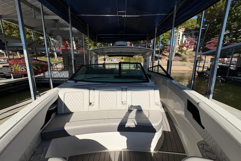 Slide: The Image of 2023 Sea Ray SLX 400 boat interior with luxurious seating and waterfront view. - 51