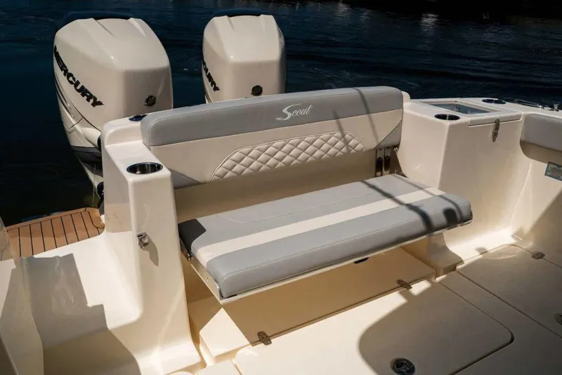 Slide: The Image of Manufacturer Provided Image: 2025 Scout 330 LXF boat with cushioned seating and dual Mercury engines. - 11