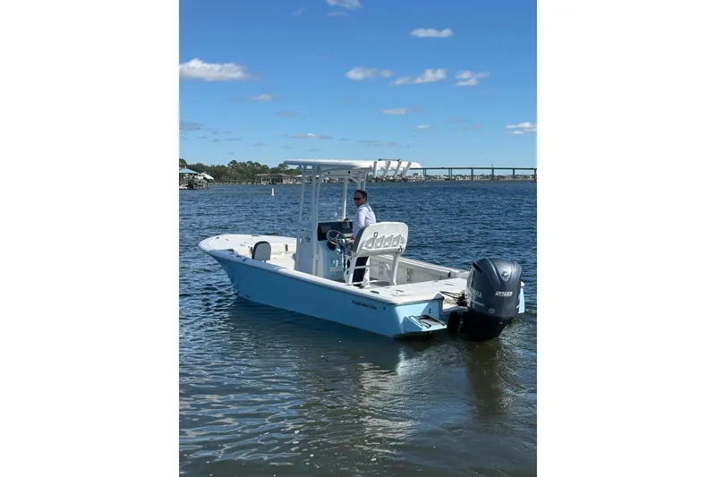 Slide: The Image of 2020 Tidewater 2300 Carolina Bay boat on water with Yamaha engine. - 10