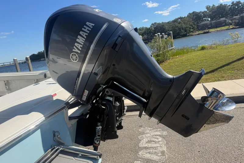 Slide: The Image of 2020 Tidewater 2300 Carolina Bay with Yamaha outboard motor by a scenic waterfront. - 12