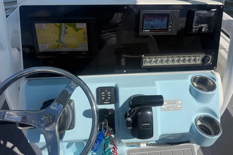 Slide: The Image of Control panel of 2020 Tidewater 2300 Carolina Bay boat with Garmin and Yamaha displays. - 13