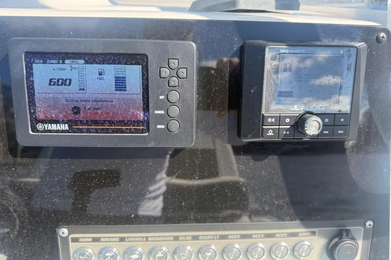 Slide: The Image of Dashboard of 2020 Tidewater 2300 Carolina Bay with Yamaha and JL Audio displays. - 14