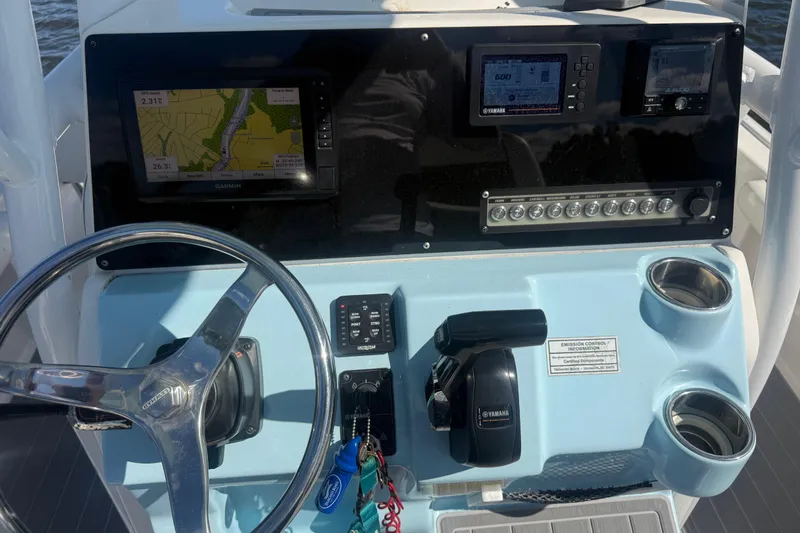 Slide: The Image of 2020 Tidewater 2300 Carolina Bay boat dashboard with navigation and control systems. - 15