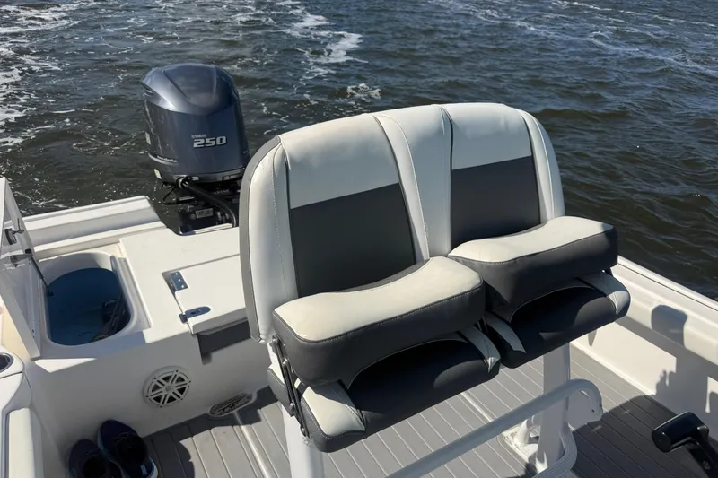 Slide: The Image of 2020 Tidewater 2300 Carolina Bay boat with dual seats and Yamaha 250 engine on water. - 19