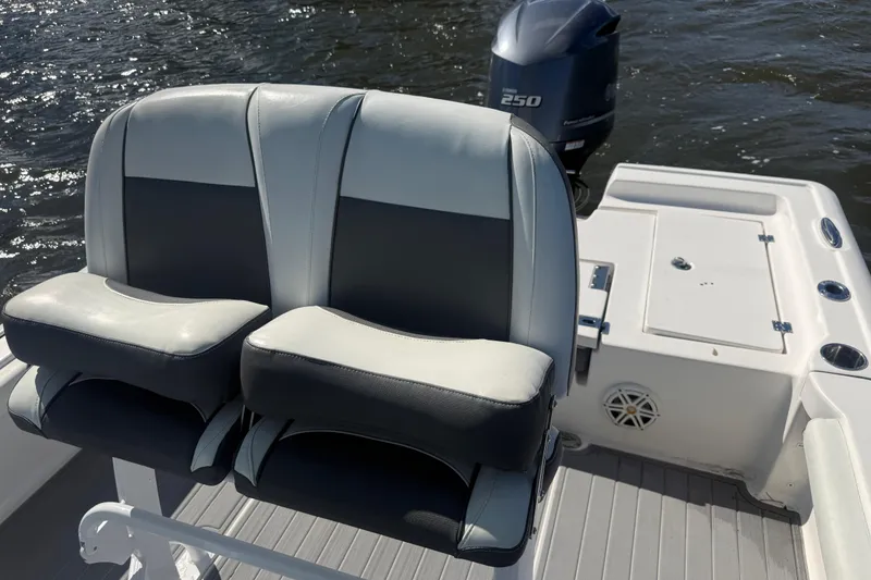 Slide: The Image of 2020 Tidewater 2300 Carolina Bay boat seats and Yamaha 250 engine on water. - 20