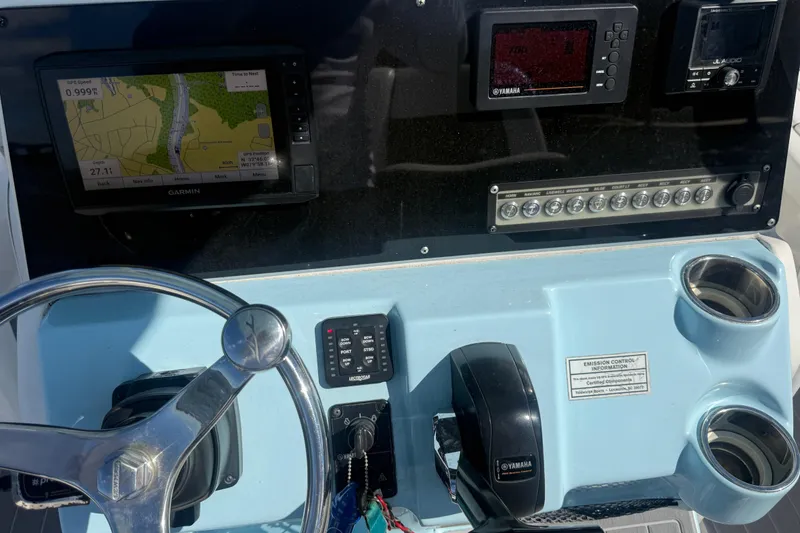 Slide: The Image of 2020 Tidewater 2300 Carolina Bay dashboard with Garmin navigation and Yamaha controls. - 21