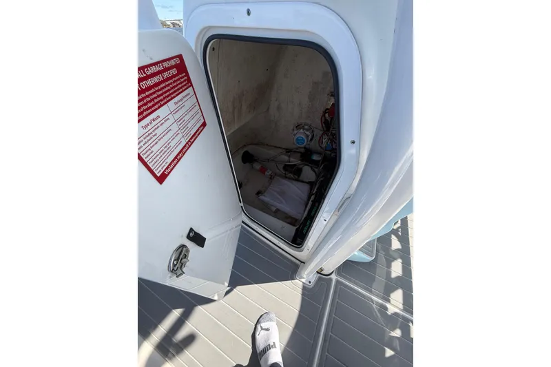 Slide: The Image of Open storage compartment on 2020 Tidewater 2300 Carolina Bay boat deck. - 27
