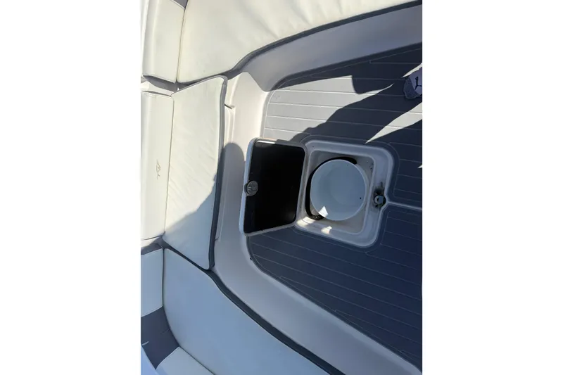 Slide: The Image of 2020 Tidewater 2300 Carolina Bay boat interior with seating and storage compartments. - 28
