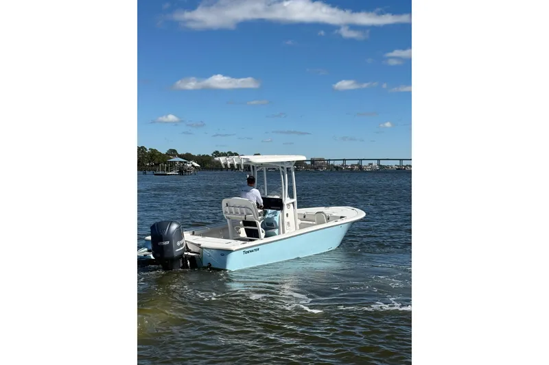 Slide: The Image of 2020 Tidewater 2300 Carolina Bay boat on calm water under blue sky. - 4